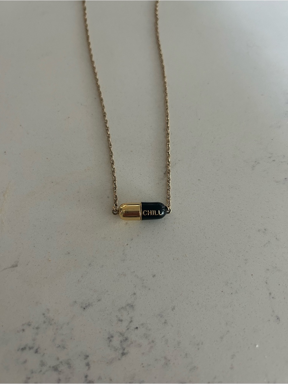 Gold and Black 'CHILL' Capsule Necklace